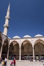 Tourists in the courtyard of the Blue Mosque, historic mosque located in Istanbul, Turkey. A popular tourist site Royalty Free Stock Photo